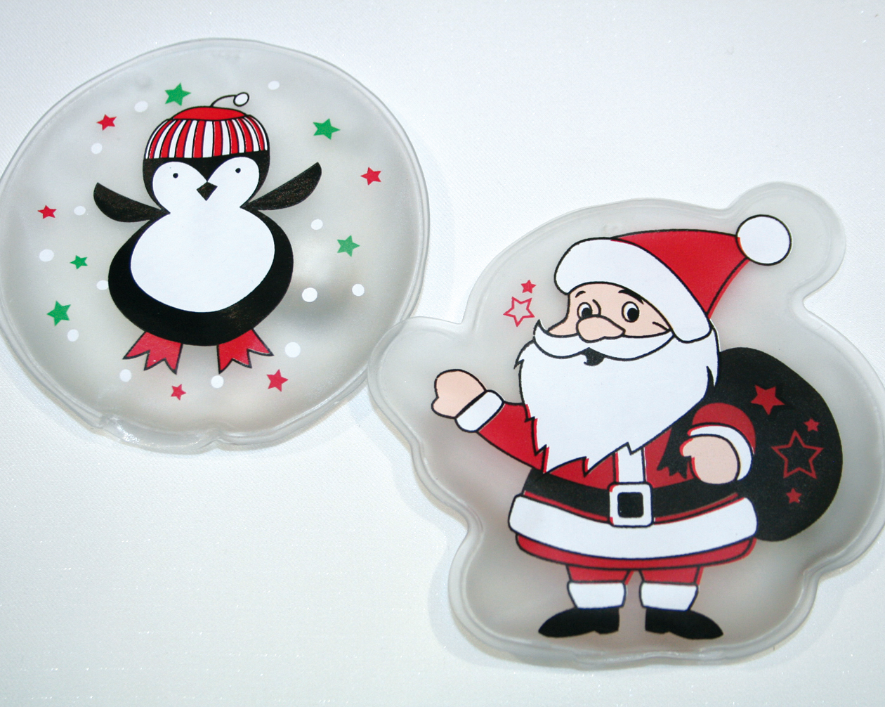 Pocket warmer 'Santa/Penguin' in round shape